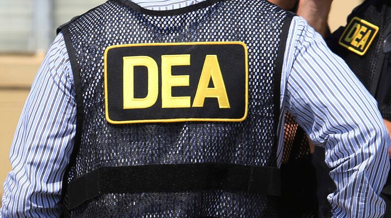 FILE - Lettering marks Drug Enforcement Administration agent's uniforms in Florida, June 13, 2016. (Joe Burbank/Orlando Sentinel via AP, File/Orlando Sentinel via AP, File)