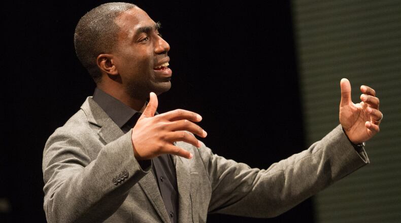Pastor Lee May speaks to his congregation during the Sunday morning service at Transforming Faith Church at Southwest DeKalb High School on Oct. 29, 2017. STEVE SCHAEFER / SPECIAL TO THE AJC