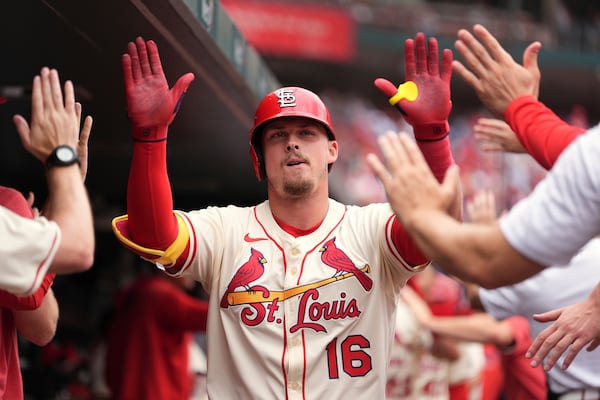 St. Louis Cardinals' Nolan Gorman is congratulated by teammates after hitting a two-run home run during the second inning of a baseball game against the Atlanta Braves Saturday, July 12, 2025, in St. Louis. (AP Photo/Jeff Roberson)