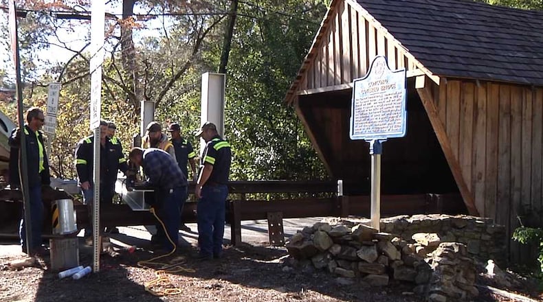 Cobb County crews on Oct. 24, 2018 replaced the beams that protect the historic Concord Road Covered Bridge.