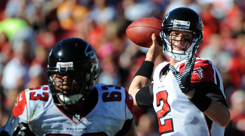 Atlanta Falcons quarterback Matt Ryan (2) throws a pass as teammate guard Justin Blalock defends during the second quarter of an NFL football game against the Tampa Bay Buccaneers Sunday, Nov. 25, 2012, in Tampa, Fla. (AP Photo/Brian Blanco)