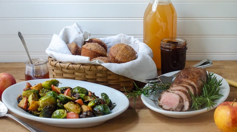 Apple cider adds fall flavors to this trio of recipes. From left: Apple Cider Hot Honey Reduction with Brussels Sprouts and Apples, Apple Cider Doughnut Muffins and Spiced Apple Cider Maple Pork Tenderloin. (Virginia Willis for The Atlanta Journal-Constitution)