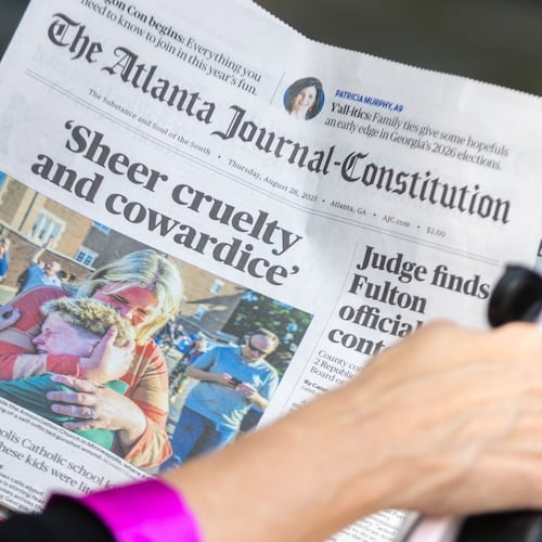 WSB reporter Linda Stouffer interviews people in front of The Atlanta Journal-Constitution building on Thursday, Aug. 28, 2025, in Atlanta. The AJC announced it would cease printing the newspaper at the end of this year. (Arvin Temkar/AJC)