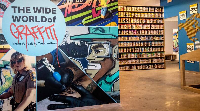 The entrance to the Museum of Graffiti in Wynwood, with a wall on the right featuring some of the original spray paints used by artists. (Jose A Iglesias/Miami Herald/TNS)