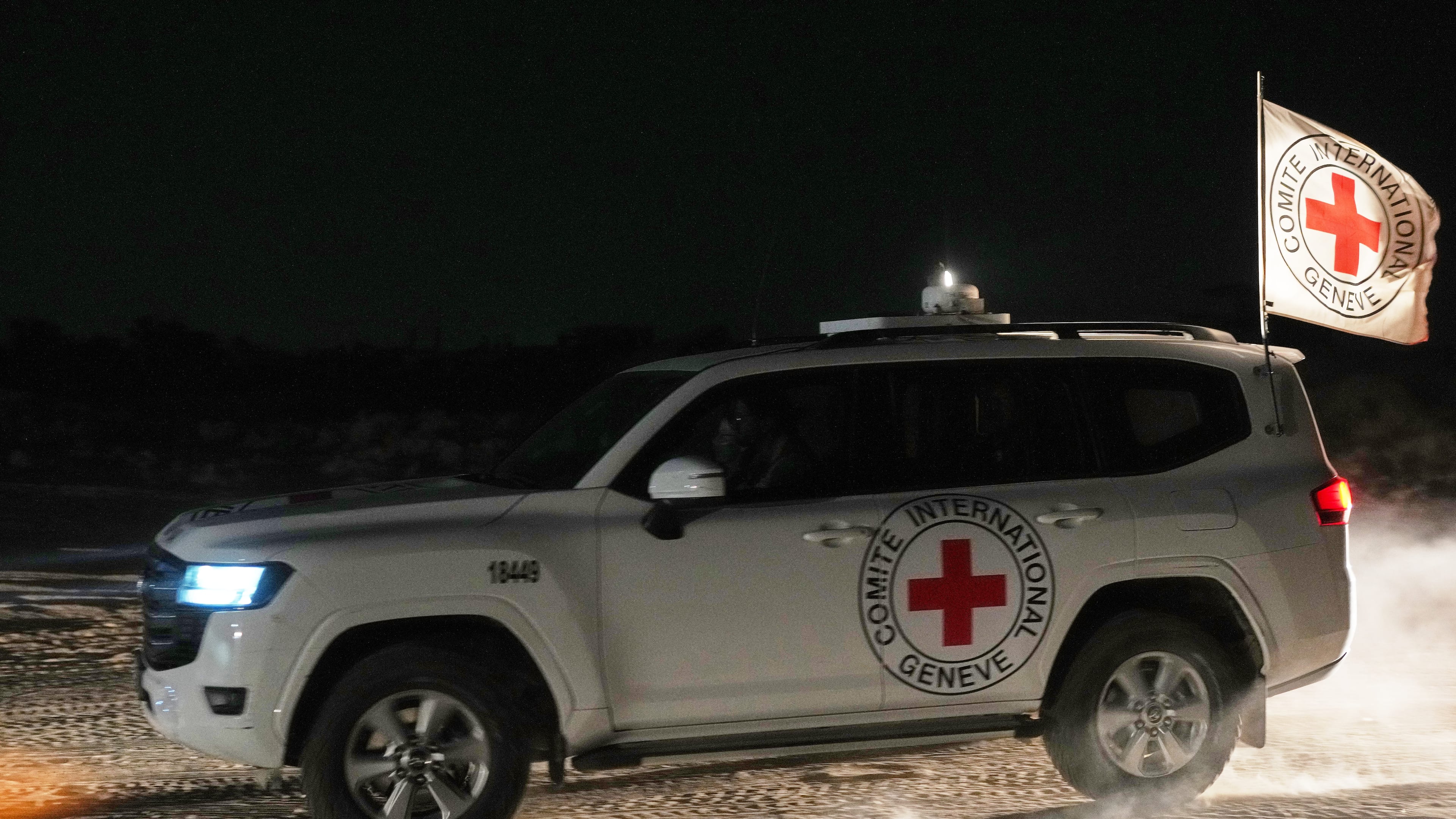 Red Cross convoy carrying the body of a person believed to be a deceased hostage handed over by Palestinians militants makes its way toward the border crossing with Israel, to be transferred to Israeli authorities, in Deir al-Balah, central Gaza Strip, Friday, Nov. 7, 2025. (AP Photo/Abdel Kareem Hana)