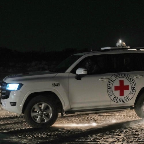 Red Cross convoy carrying the body of a person believed to be a deceased hostage handed over by Palestinians militants makes its way toward the border crossing with Israel, to be transferred to Israeli authorities, in Deir al-Balah, central Gaza Strip, Friday, Nov. 7, 2025. (AP Photo/Abdel Kareem Hana)