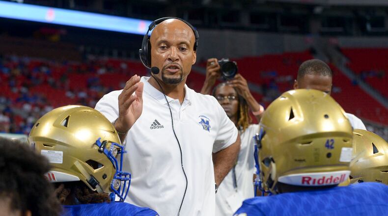 Former McEachern head coach Franklin Stephens talks to his players during a time out late in the first half of their game at the Mercedes Benz Stadium in Atlanta during the Corky Kell Classic Saturday, August 24, 2019. PHOTO/Daniel Varnado