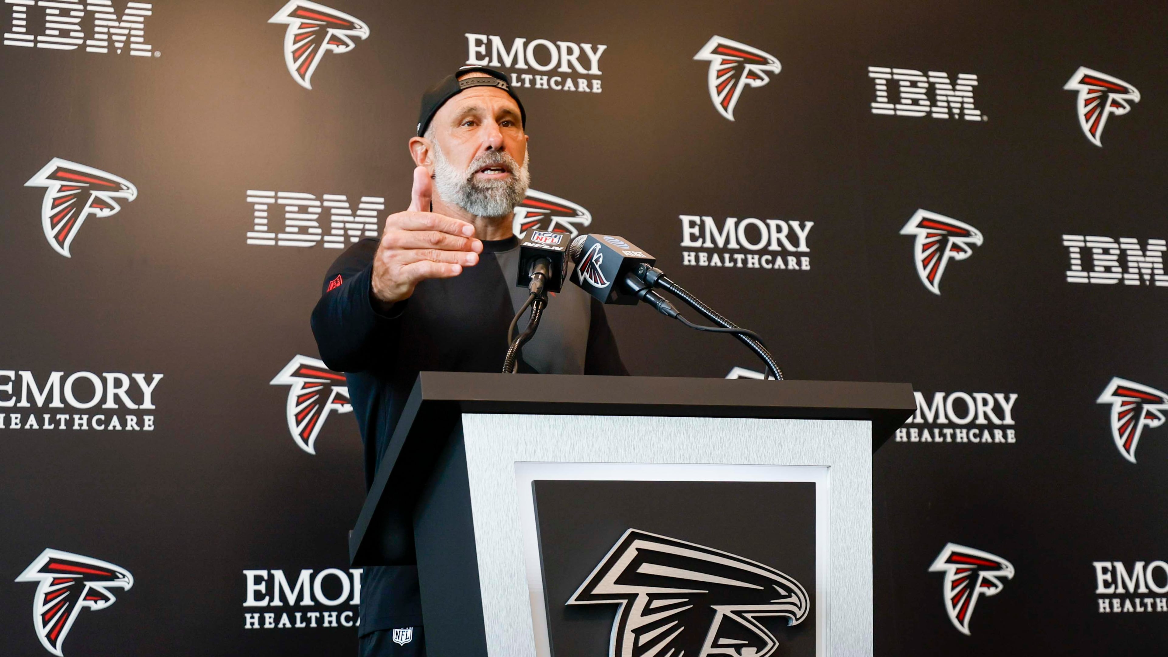 Defensive coordinator Jeff Ulbrich addresses members of the media on Tuesday, Aug. 12, 2025, in Flowery Branch. “Being in the AFC East for four years, got very familiar with Drake, especially the last year,” Ulbrich says. (Miguel Martinez/AJC)