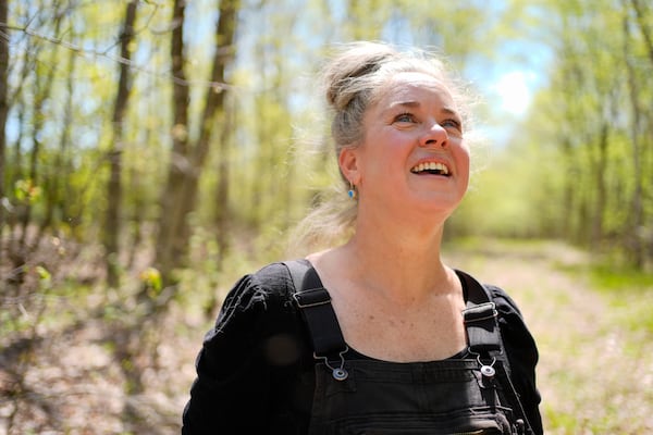 Heather Donahue, the star of the The Blair Witch Project, pauses on a walk to watch a songbird,Tuesday, May 13, 2025, in Freedom, Maine. (AP Photo/Robert F. Bukaty)