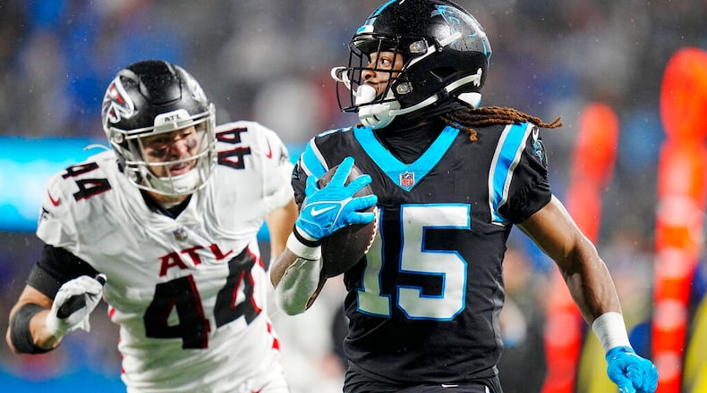 Carolina Panthers wide receiver Laviska Shenault Jr. runs for a touchdown past Falcons linebacker Troy Andersen during the first half of an NFL football game on Thursday, Nov. 10, 2022, in Charlotte, N.C. (AP Photo/Rusty Jones)