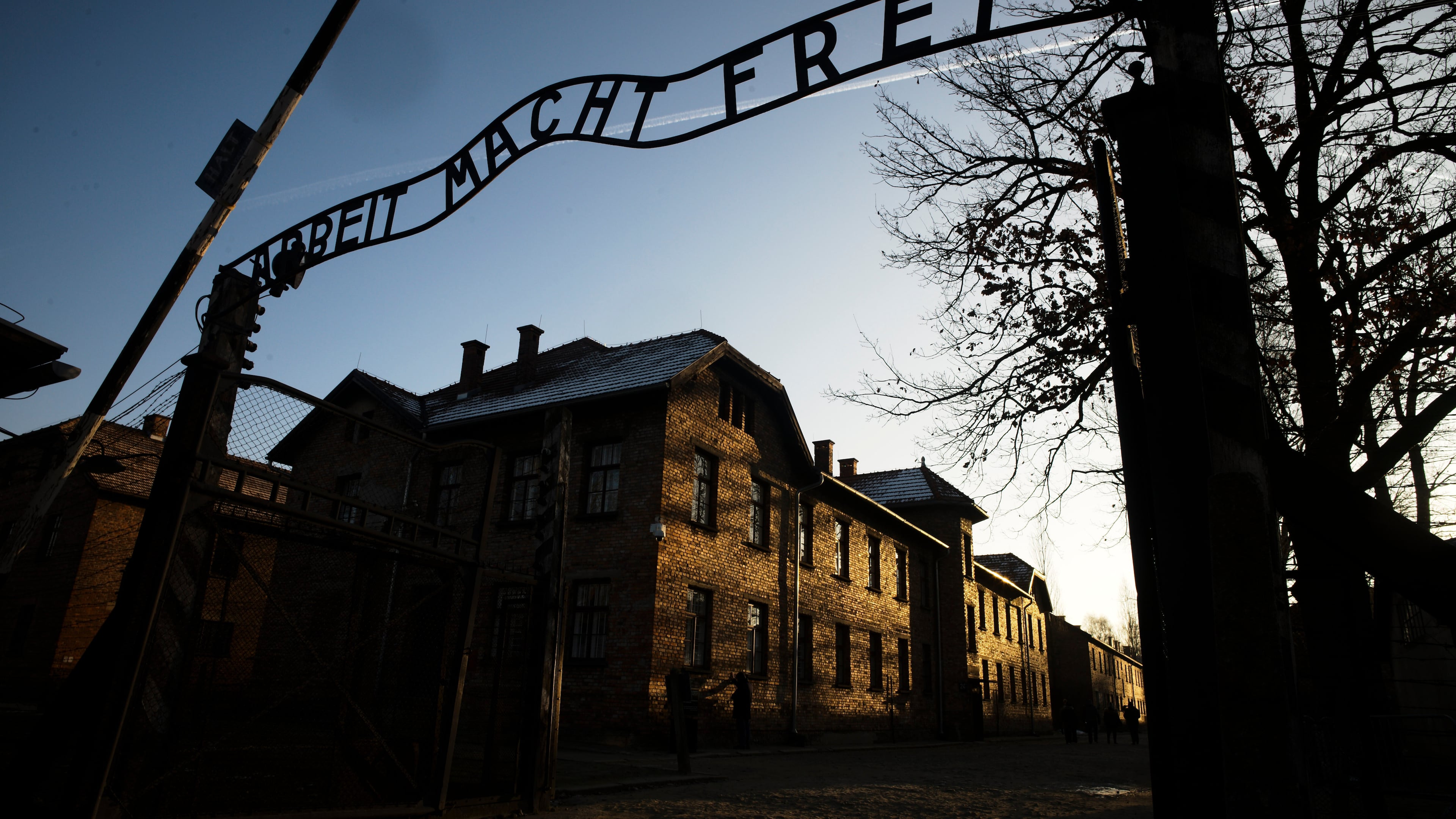 FILE - The sun lights the buildings behind the entrance of the former Nazi death camp Auschwitz-Birkenau in Oswiecim, Germany, Dec. 6, 2019. (Photo/Markus Schreiber, File)