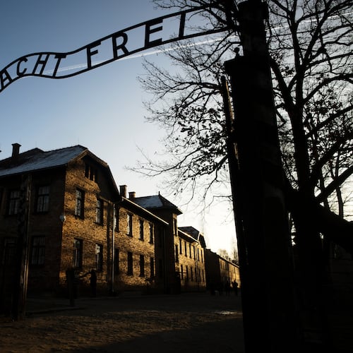 FILE - The sun lights the buildings behind the entrance of the former Nazi death camp Auschwitz-Birkenau in Oswiecim, Germany, Dec. 6, 2019. (Photo/Markus Schreiber, File)