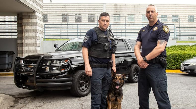 Gwinnett County Sheriff’s Office Master Deputy Jason Cotton (L) and Lt. Paul Corso are seen on the reality TV show “Live PD.” May 9, 2019. STEVE SCHAEFER / SPECIAL TO THE AJC