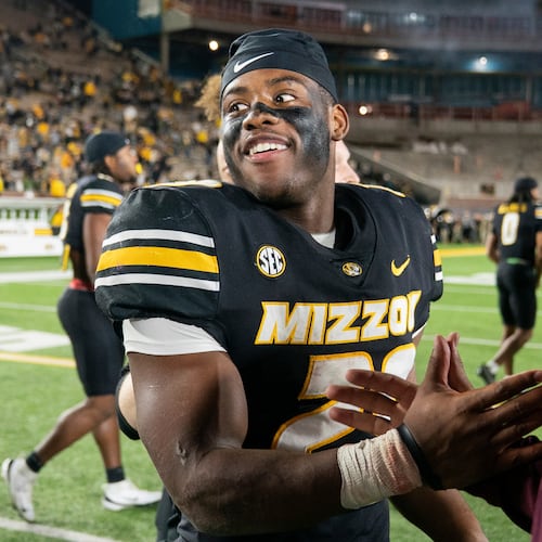 Missouri running back Ahmad Hardy, left, is congratulated after his team defeated Mississippi State in an NCAA college football game Nov. 15, 2025, in Columbia, Mo. (AP Photo/L.G. Patterson)