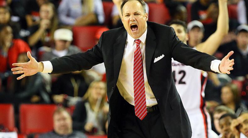 111513 ATHENS: Georgia head coach Mark Fox encourages his team against Georgia Tech during the second half of a 80-71 loss on Friday, Nov. 15, 2013, in Athens. CURTIS COMPTON /staff CCOMPTON@AJC.COM We can assume this was not Mark Fox's reaction to his new deal. (Curtis Compton/AJC)