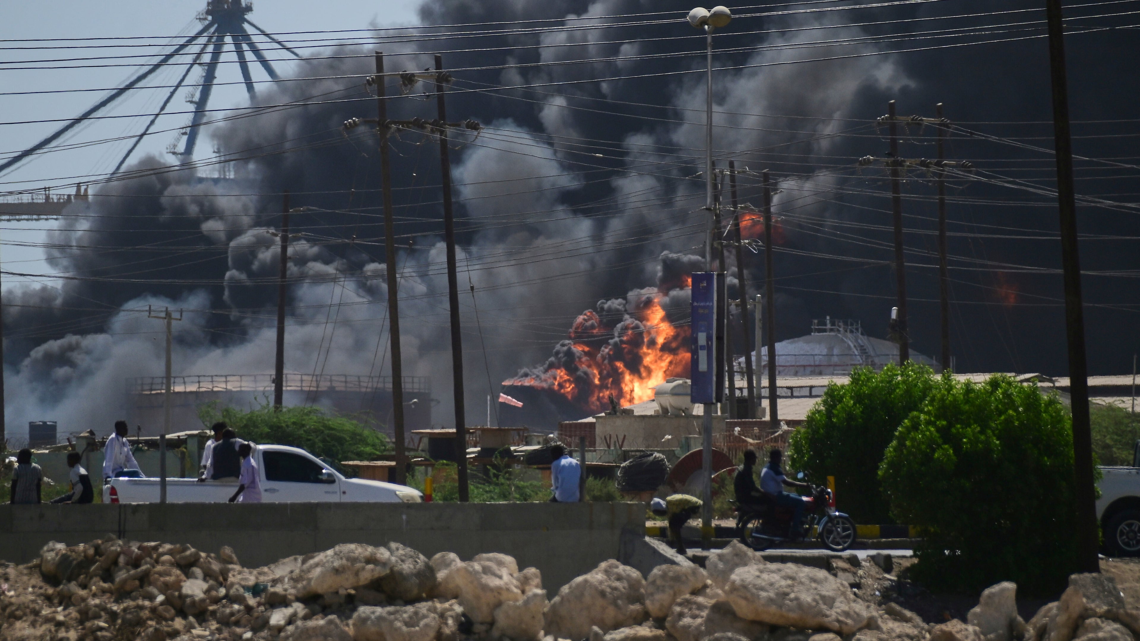 FILE - Smoke billows after drone strikes by the paramilitary Rapid Support Forces (RSF) targeted the northern port in the Red Sea city of Port Sudan, Sudan, Tuesday, May 6, 2025. (AP Photo/File)