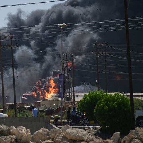 FILE - Smoke billows after drone strikes by the paramilitary Rapid Support Forces (RSF) targeted the northern port in the Red Sea city of Port Sudan, Sudan, Tuesday, May 6, 2025. (AP Photo/File)