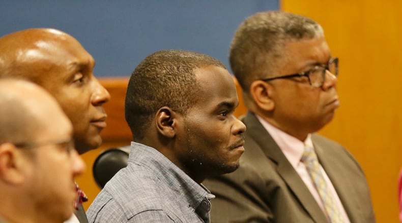 Basil Eleby sits with his attorneys in court on Tuesday, April 18 2017. BOB ANDRES/AJC