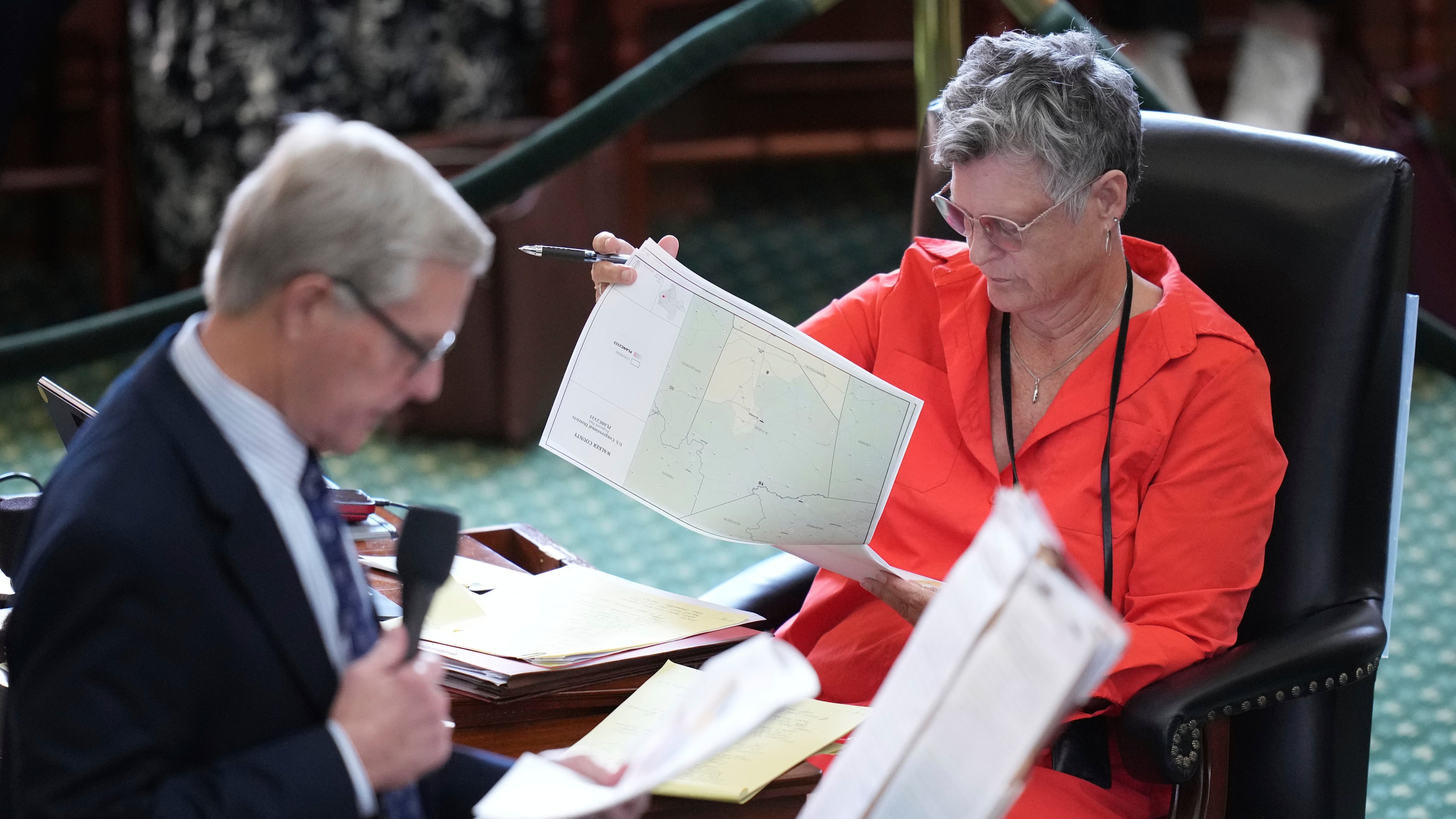 FILE - Texas state Sen. Sarah Eckhardt, D-Austin, right, listens as Sen. Phil King, R-Weatherford, speaks in favor of a bill before a vote on a redrawn U.S. congressional map during a special session in the Senate Chamber at the Texas Capitol in Austin, Texas, Aug. 22, 2025. (AP Photo/Eric Gay, File)