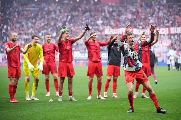 Bayern players thank the fans at the end of the German Bundesliga soccer match between RB Leipzig and FC Bayern Munich at the Red Bull Arena in Leipzig, Germany, Saturday, May 3, 2025. (AP Photo/Ebrahim Noroozi)