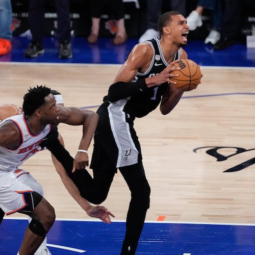 San Antonio Spurs forward Victor Wembanyama, right, drives as New York Knicks forward Og Anunoby, left, defends during the second half of Game 4 of the NBA Finals basketball series, Wednesday, June 10, 2026, in New York. (AP Photo/Ross D. Franklin)