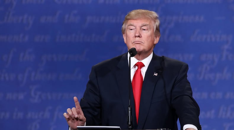 Donald Trump gestures as he speaks during the third U.S. presidential debate. (Photo by Win McNamee/Getty Images)