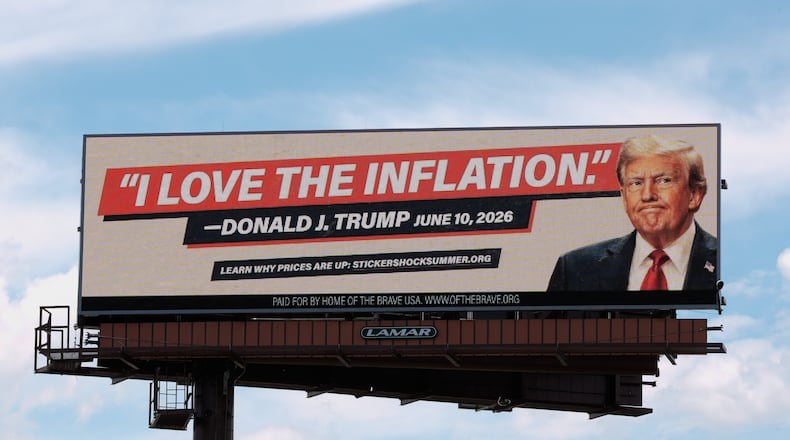 An electronic billboard with an image of President Donald Trump reads "I love the inflation." - Donald J. Trump June 10, 2026," is seen near I-74 in Cincinnati, Tuesday, June 16, 2026. (AP Photo/Carolyn Kaster)
