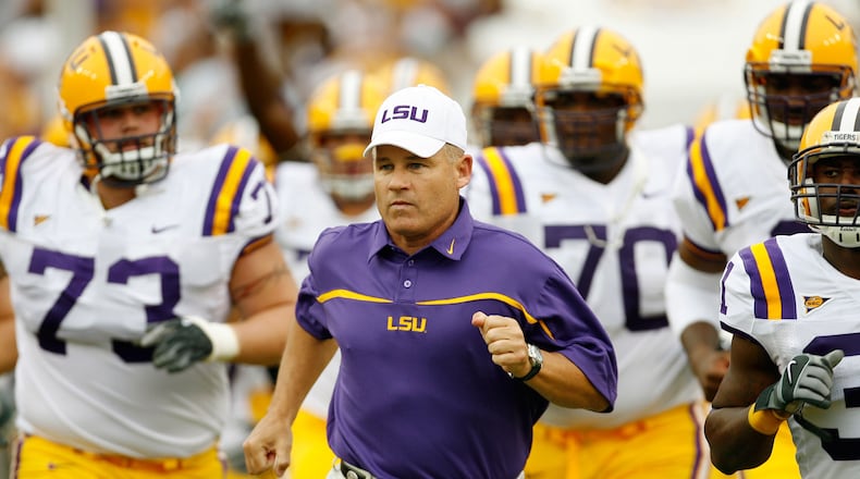 LSU reportedly has fired coach Les Miles and offensive coordinator Cam Cameron, the day following a loss to Auburn. (AP photo)
