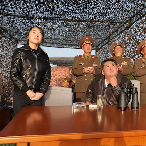 In this photo provided by the North Korean government, its leader Kim Jong Un, sitting, with his daughter observes what it says a test launch of an upgraded surface-to-surface ballistic missile at an undisclosed place in North Korea Sunday, April 19, 2026. Independent journalists were not given access to cover the event depicted in this image distributed by the North Korean government. The content of this image is as provided and cannot be independently verified. Korean language watermark on image as provided by source reads: "KCNA" which is the abbreviation for Korean Central News Agency. (Korean Central News Agency/Korea News Service via AP)