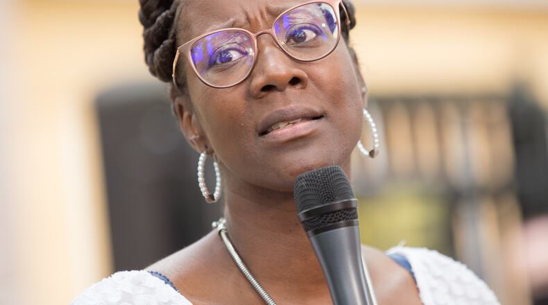 Dawn Wooten, a LPN, who worked in the Irwin County Detention Center in Ocilla, GA on and off for more than 5 years, expresses concerns Tuesday, Sept 15, 2020, about health and safety conditions at the immigration detention center during Covid where PPE are not distributed regularly to nurses, detainees or staff.  Wooten and supporters hold a press conference in front of the Atlanta ICE field office.  (Jenni Girtman for The Atlanta Journal-Constitution)