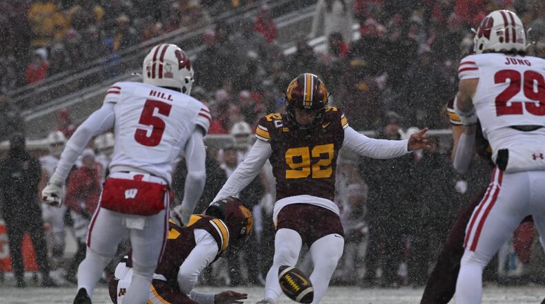 FILE - Minnesota kicker Brady Denaburg attempts a field goal during the first half of an NCAA college football game against Wisconsin Nov. 29, 2025, in Minneapolis. (AP Photo/Tom Baker, File)