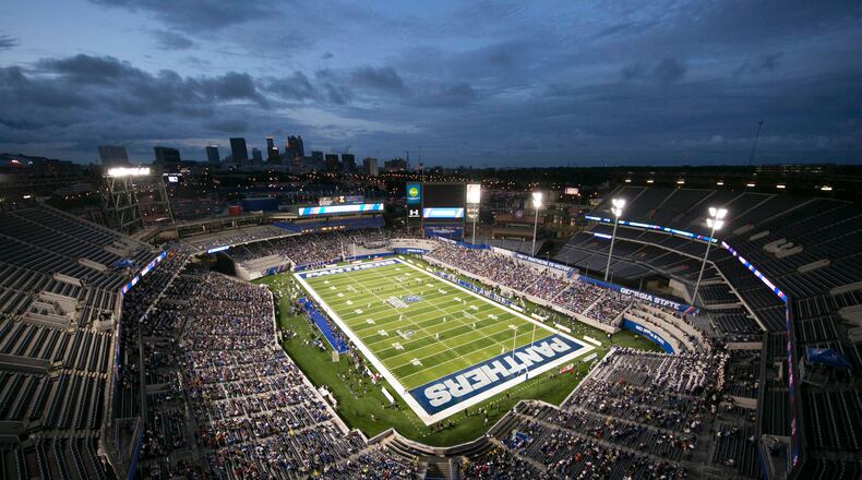 People watch the first half of an NCAA college football game between Georgia State and Tennessee State in Atlanta, Thursday, Aug. 31, 2017. (Jason Getz /Atlanta Journal-Constitution via AP)