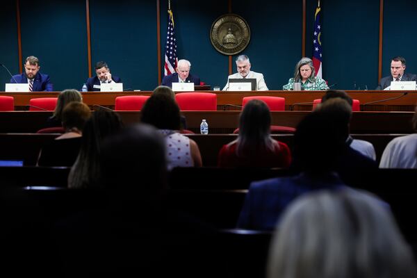 People listen to a panel of lawmakers discussing recommendations for a new voting system at the Paul D. Coverdell Legislative Office Building in Atlanta on Friday, Aug. 7, 2026. (Abbey Cutrer/AJC)
