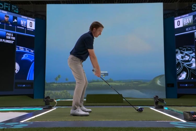 Roberto Castro tests out the simulator used by TGL Golf at the SoFi Center in Palm Beach Gardens, Fla. The Georgia Tech grad helped refine and shape the platform and has joined the broadcast team as an analyst. (Courtesy of TGL Golf)