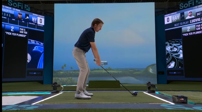 Roberto Castro tests out the simulator used by TGL Golf at the SoFi Center in Palm Beach Gardens, Fla. The Georgia Tech grad helped refine and shape the platform and has joined the broadcast team as an analyst. (Courtesy of TGL Golf)