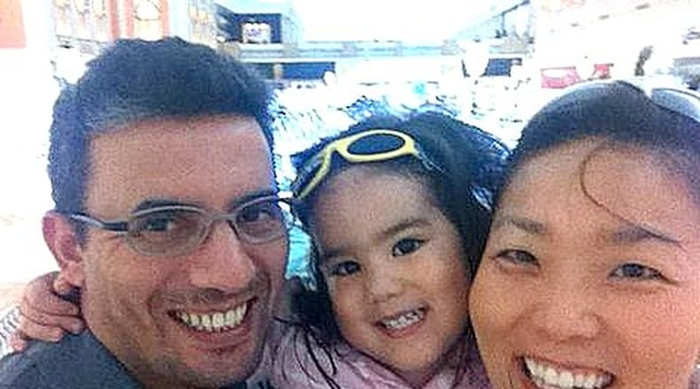 Grace O and Zaier Aouani with their daughter, Zeinah. A daycare fire killed Zeinah, as well as 12 other children and six adults. (Family photo)