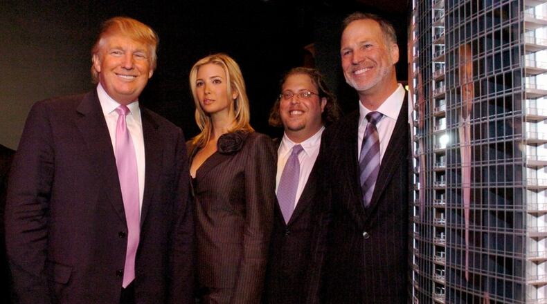Donald Trump with daughter Ivanka and partners Gil Dezer (second from right) and Mark Randall stand next to a scale model of the proposed $300 million Trump Towers project in Midtown Atlanta in April 2007. (CHARLOTTE B. TEAGLE / AJC Staff).