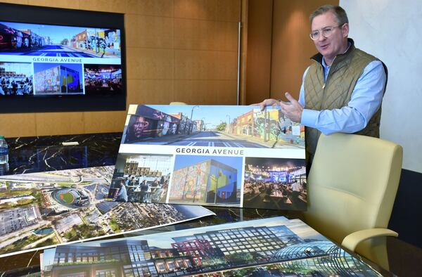 Scott Taylor, CEO of the Atlanta real estate development firm Carter, shows off renderings for the planned redevelopment of the Turner Field area in January 2017. Georgia State University and a private development team led by Carter acquired the former Atlanta Braves stadium near downtown that month. HYOSUB SHIN / HSHIN@AJC.COM