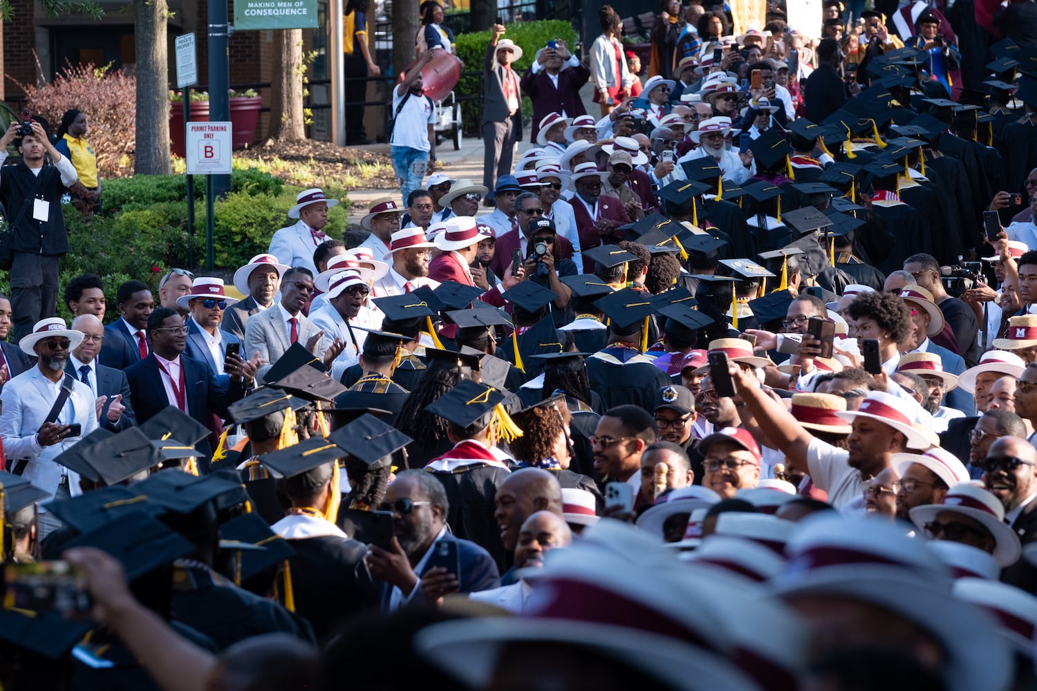 Morehouse College alumni line the alumni corridor as the 2026 graduates begin their procession Sunday, May 17, 2026. (Ben Gray for the AJC)