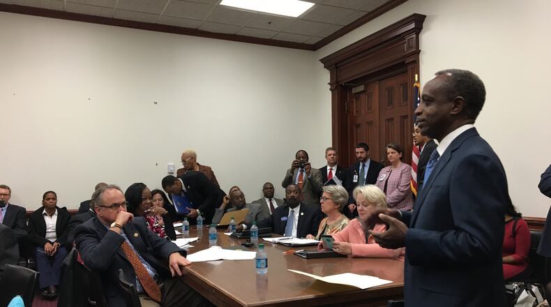 The DeKalb County Board of Commissioners and CEO Mike Thurmond asked the county's delegation to the Georgia House of Representatives to consider sales taxes for infrastructure and MARTA. Seated from left are Commissioners Jeff Rader, Greg Adams, Mereda Davis Johnson, Nancy Jester, Larry Johnson, Steve Bradshaw, Kathie Gannon and Rep. Mary Margaret Oliver. Thurmond is speaking. MARK NIESSE / MARK.NIESSE@AJC.COM