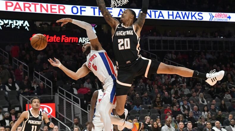 January 18, 2020 Atlanta - Detroit Pistons guard Bruce Brown (6) and Atlanta Hawks forward John Collins (20) fight for a rebound in the first half during a NBA basketball game at State Farm Arena on Saturday, January 18, 2020. (Hyosub Shin / Hyosub.Shin@ajc.com)