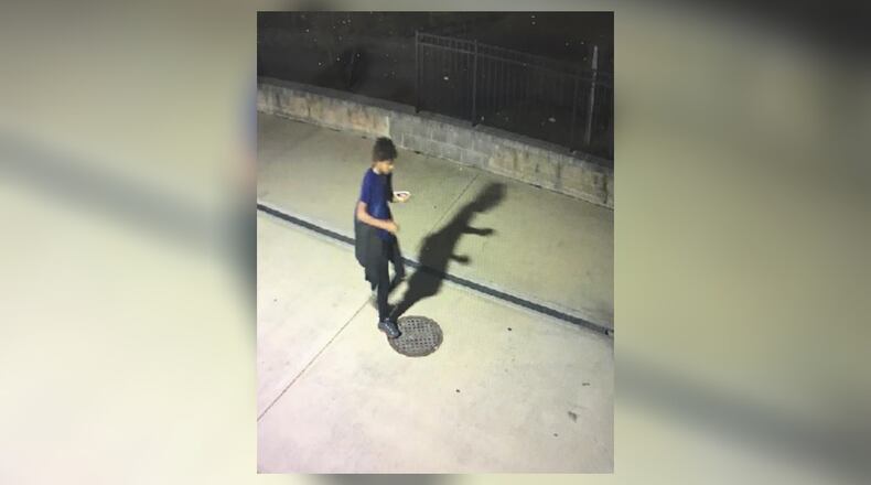 Police said this person was seen on surveillance video carrying the victim’s phone and throwing it away.