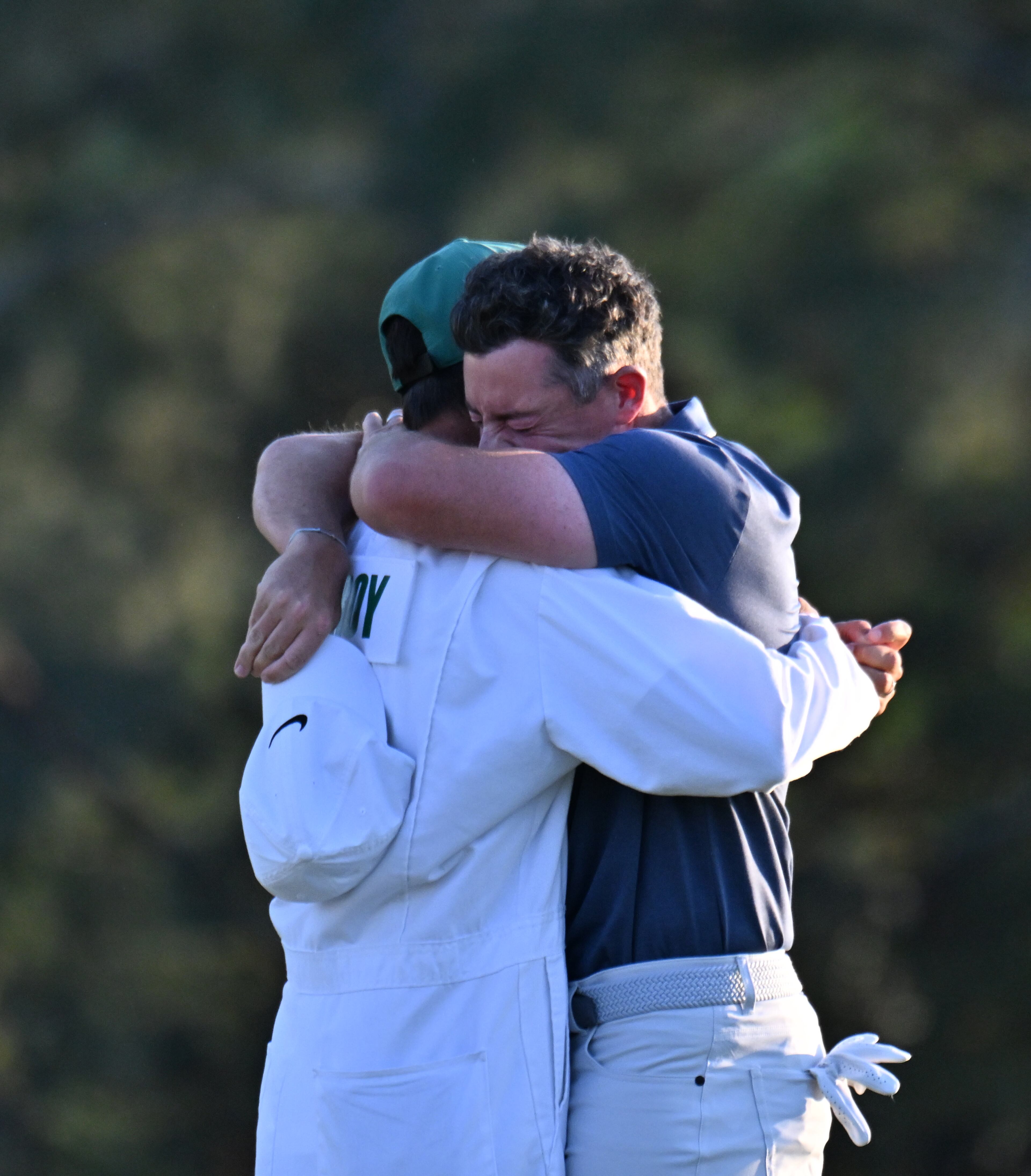Rory McIlroy celebrates with caddie Harry Diamond, winning the Masters golf tournament with a birdie in the first playoff hole during final round of the Masters golf tournament, at Augusta National Golf Club, Sunday, April 13, 2025, in Augusta, Ga. (Hyosub Shin / AJC)