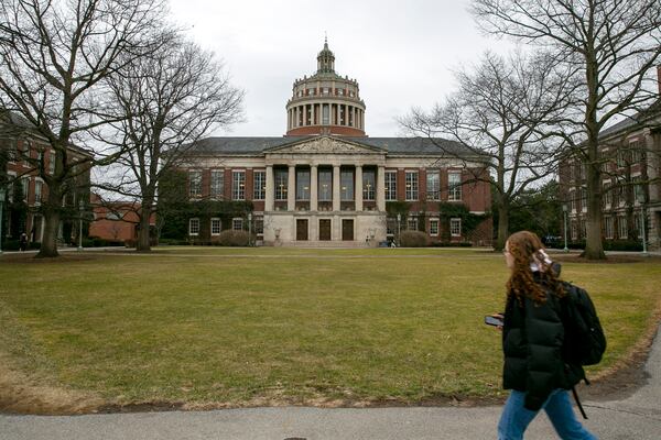 FILE - A student walks by the Rush Rhees Library at the University of Rochester, Feb. 22, 2023. (AP Photo/Ted Shaffrey, File)