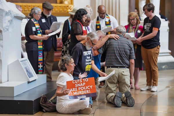 Activists opposed to President Donald Trump's tax breaks and spending cuts recently gathered to pray in the Capitol Rotunda in Washington.