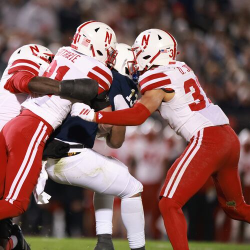 Penn State running back Kaytron Allen is tackled by a group of Nebraska defenders during the first quarter of an NCAA college football game against Nebraska, Saturday, Nov. 22, 2025, in State College, Pa. (AP Photo/Jared Freed)