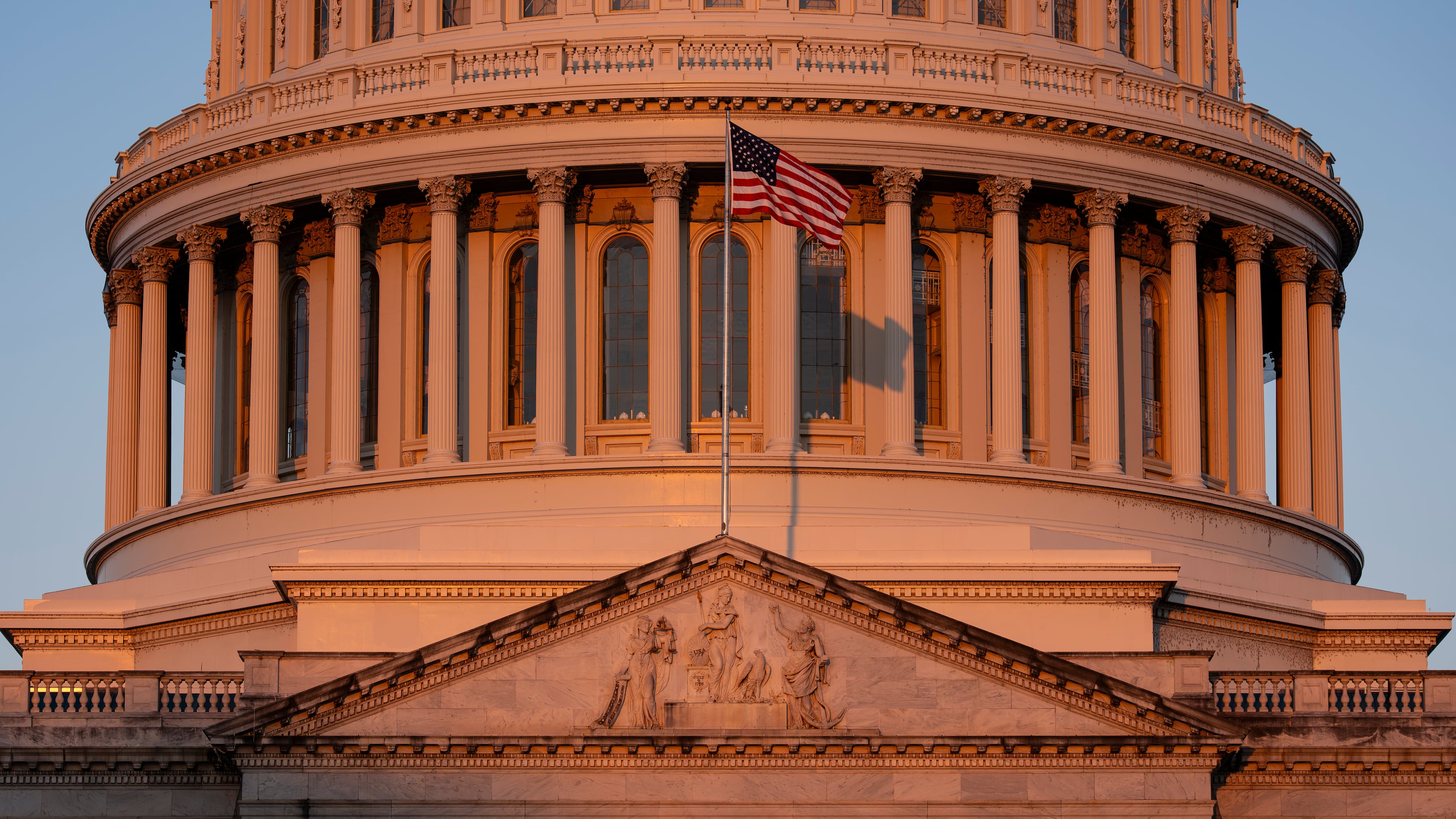 The Capitol is illuminated at dawn in Washington, Monday, Oct. 6, 2025. (AP Photo/J. Scott Applewhite)