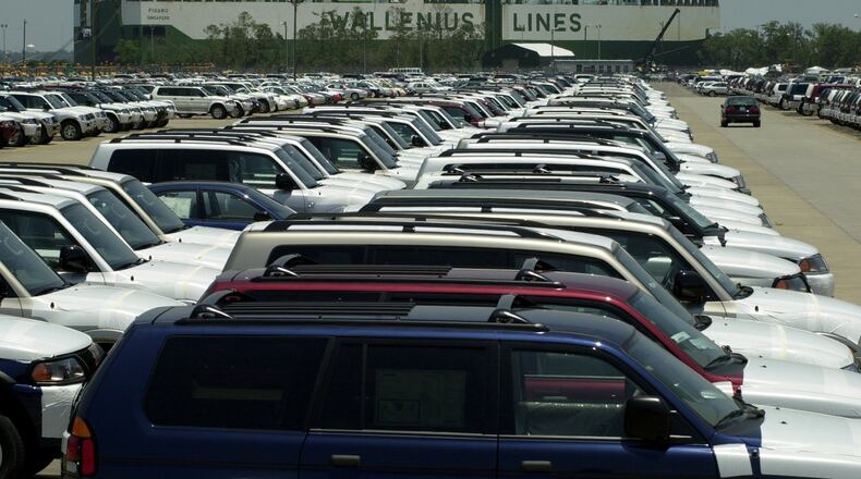 A cargo ship is tied to the dock of the Port of Brunswick in this 2015 AJC file photo. About 20,000 automobiles are usually on hand after their arrival from sea, according to port officials.