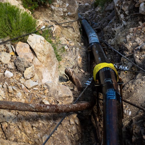 FILE - A section of pipeline that brings water to the South Rim of Grand Canyon National Park is seen below Bright Angel Lodge in Arizona, Aug. 30, 2024. (AP Photo/Ty ONeil, File)