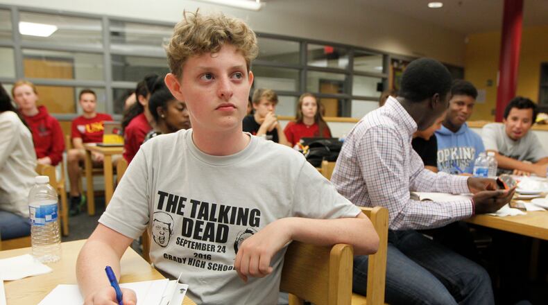 SEPTEMBER 26, 2016, ATLANTA : Grady High School debate team member Harrison Gray listens to Monday's debate between Presidential candidates Hillary Clinton and Donald Trump while watching with other debate members at Grady High School Monday, September 26, 2016. TAMI CHAPPELL/SPECIAL TO THE AJC